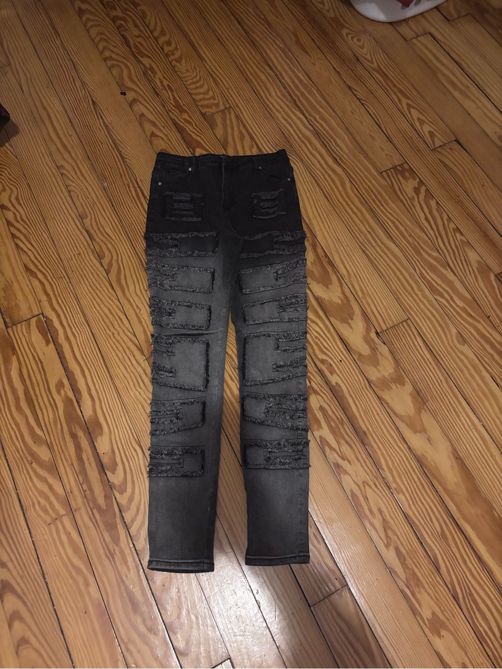Fashion Nova’s Black Skinny Distressed Jeans